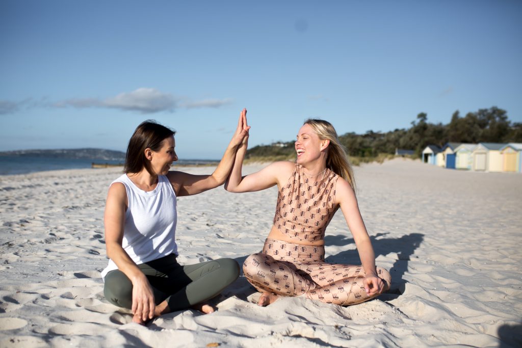 2 women happy and doing yoga in Dromana.