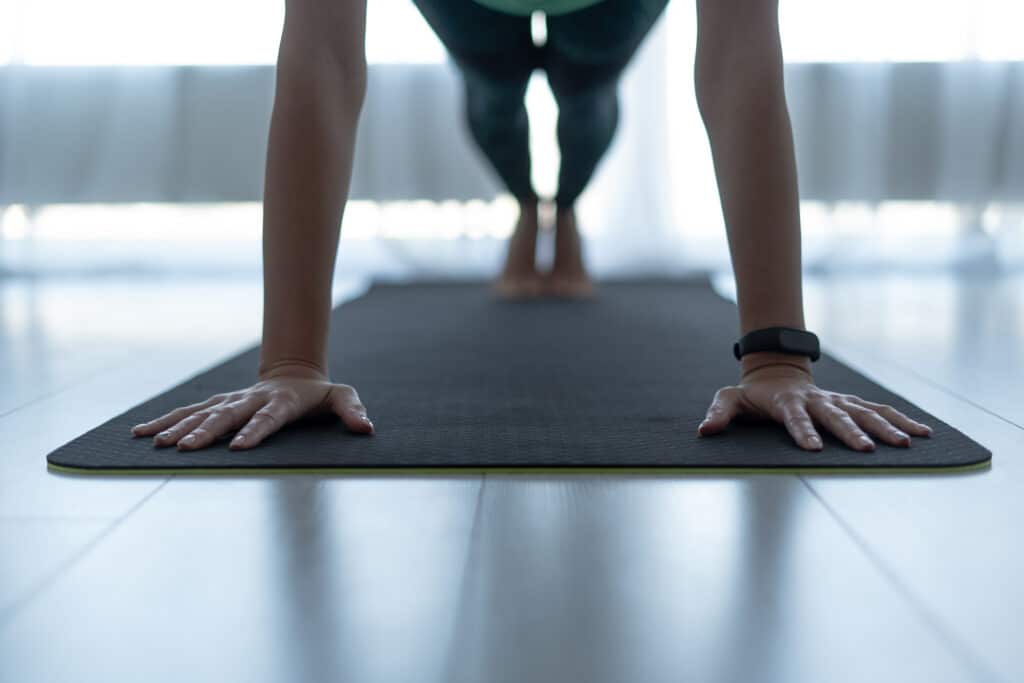 Woman doing pilates on mat.