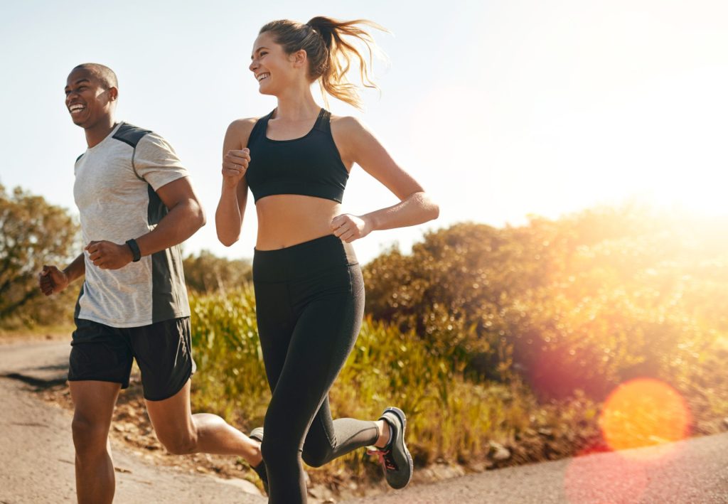 Weight loss coach and student going for a run.